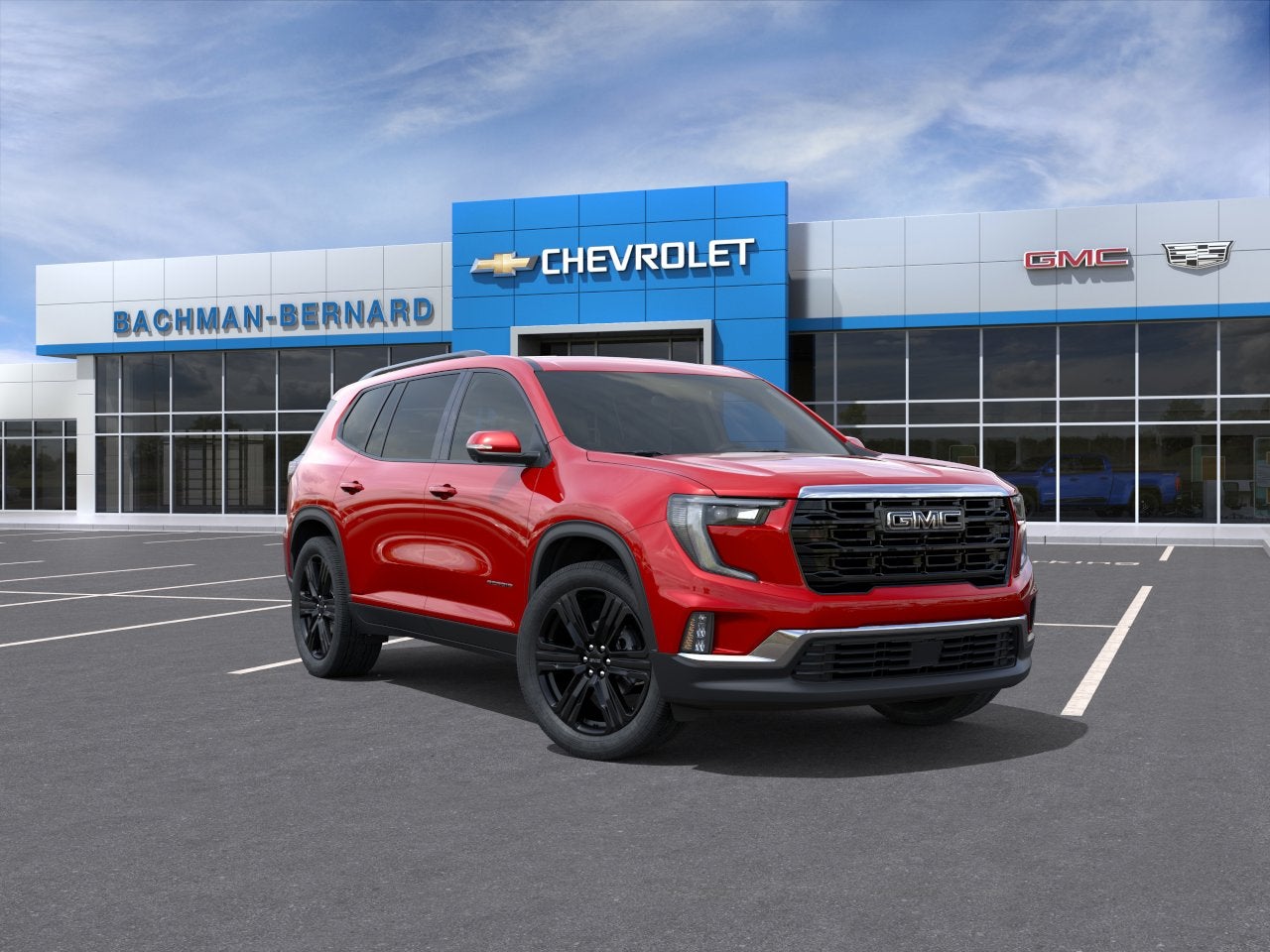 2026 GMC Acadia Elevation in Volcanic Red Tintcoat — front three-quarter view