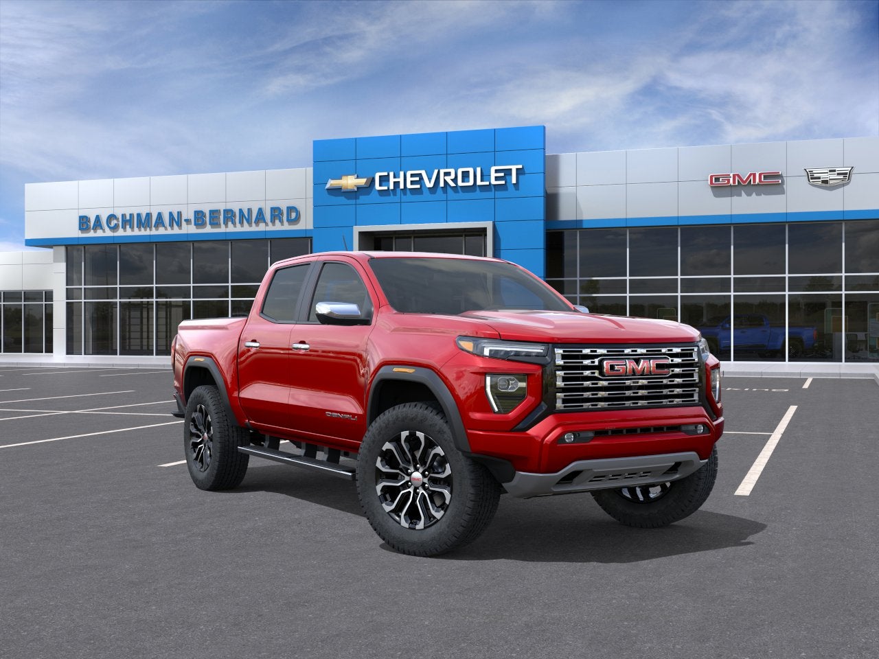 2026 GMC Canyon Denali in Volcanic Red Tintcoat — front three-quarter view
